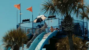 Tourist Goes Down Slide at Waterpark