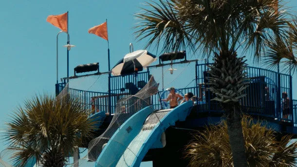 Tourist Goes Down Slide at Waterpark